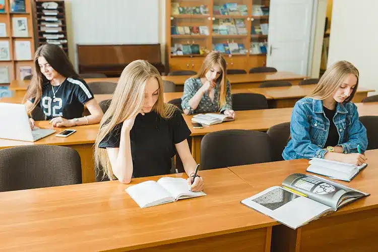 teen-girls-studying-classroom